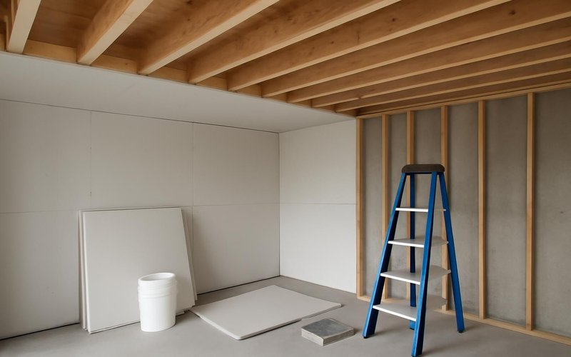 AI concept: Type X fire-rated drywall on basement ceiling joists