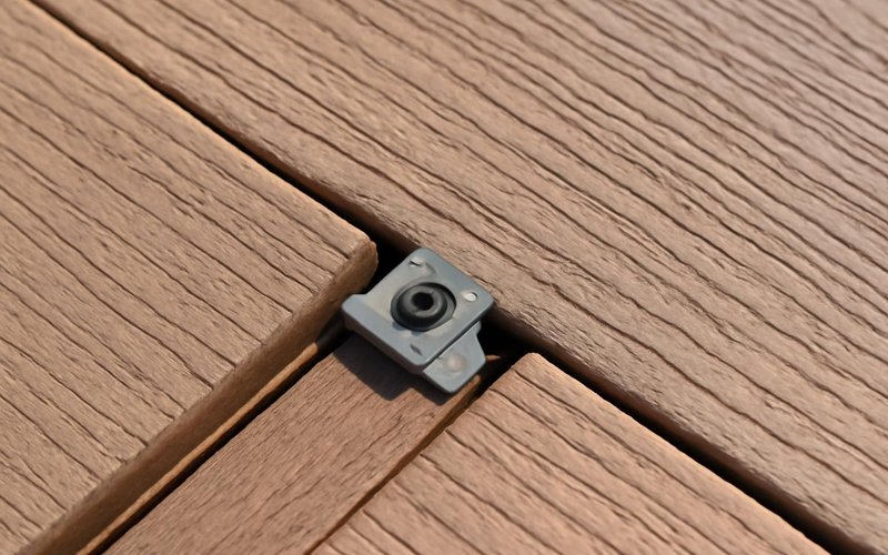 AI concept: Hidden fastener clip between two grooved composite boards