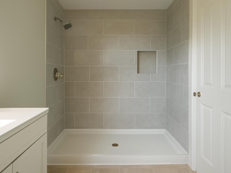 AI concept: Remodeled idea: rebuilt bathroom with a new shower pan, done before the kitchen