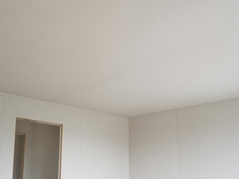 AI concept: Remodeled idea: new 5/8-inch drywall ceiling finished smooth and primed