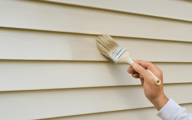 AI concept: Vinyl siding being painted a light color