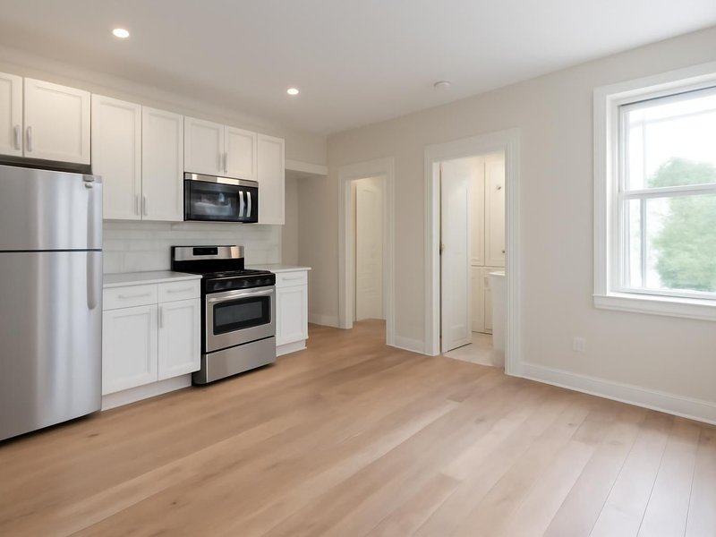 AI concept: Remodeled idea: condo with a new kitchen, one full bath and wide-plank floors