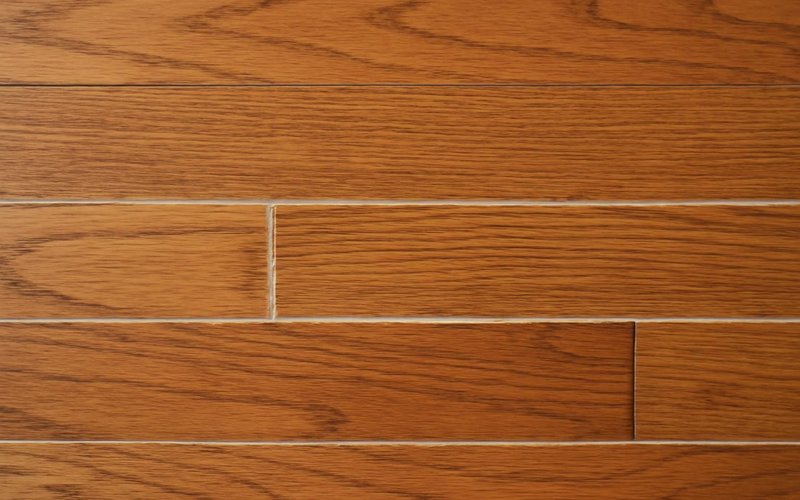 AI concept: Filler troweled into small gaps between boards