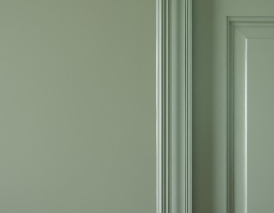 AI concept: Matte wall paint beside a semi-gloss painted door frame in the color
