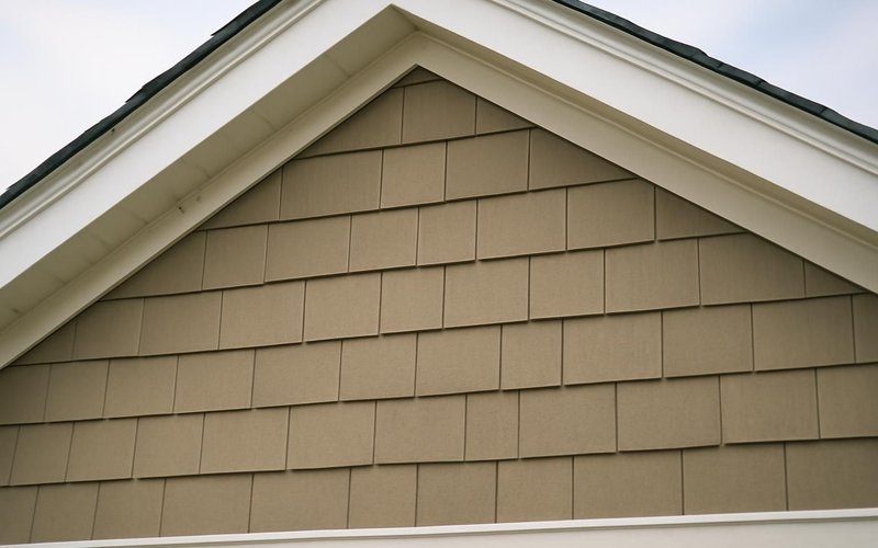 AI concept: HardieShingle staggered edge siding in a gable