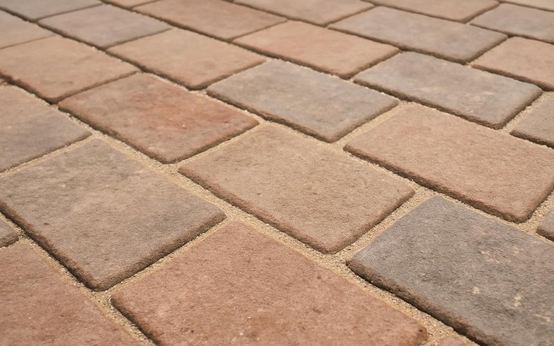 AI concept: Polymeric sand swept into paver joints