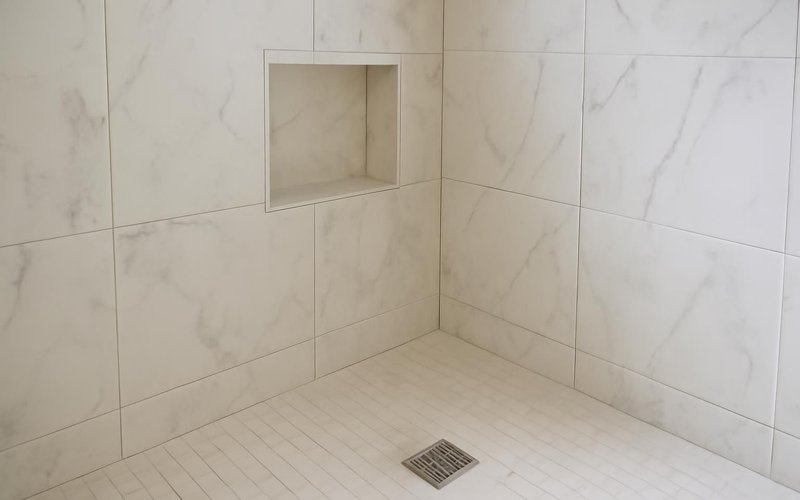 AI concept: Porcelain slab shower walls with a recessed niche
