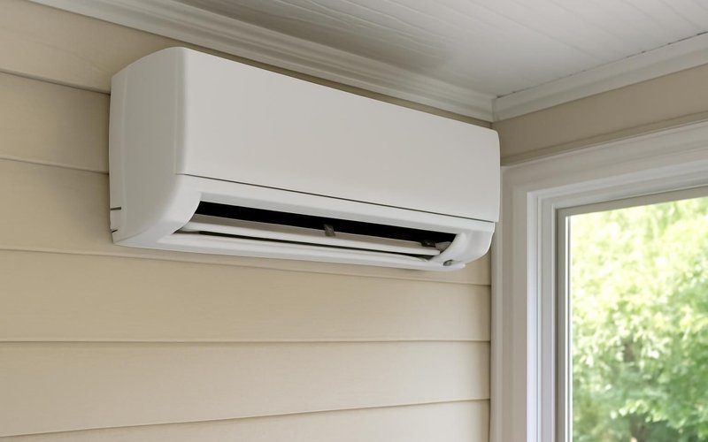 AI concept: Ductless mini-split mounted on a sunroom wall