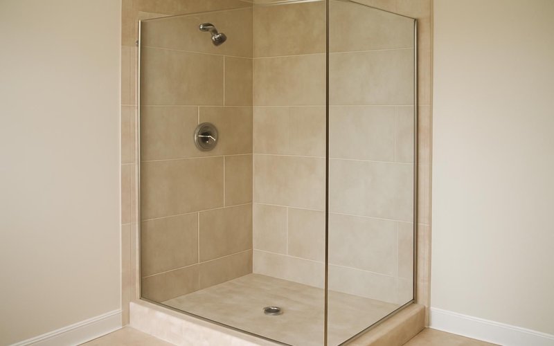 AI concept: Frameless glass panel on a converted shower