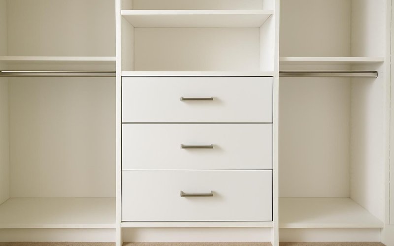 White melamine closet built-in with drawers