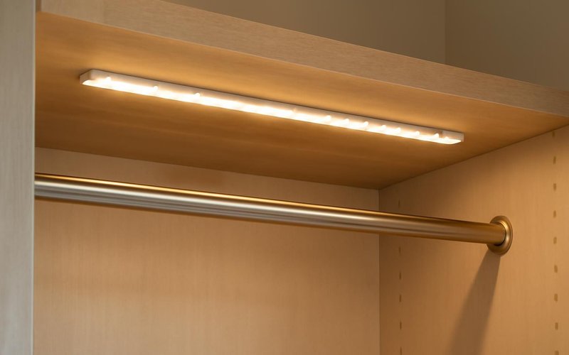 LED strip light over a closet hanging rod