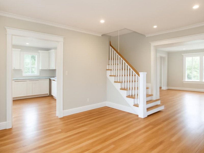 AI concept: Remodeled idea: painted trim, brighter lighting and one continuous floor downstairs